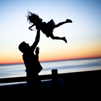 father playing with child
